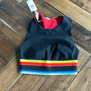 Nokaoi size 00 (XS) black rainbow women’s athletic training top.